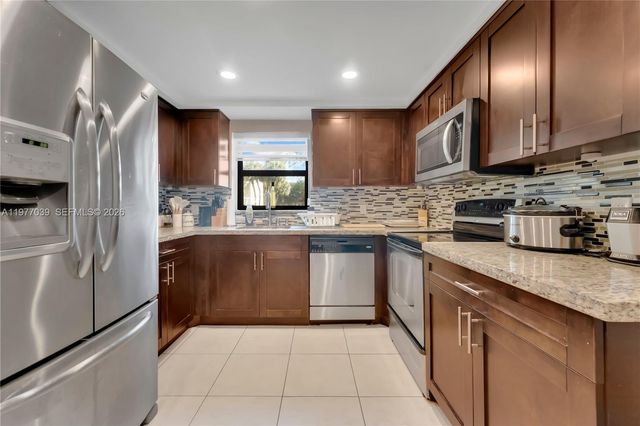 16200 Golf Club Rd 102, Weston, FL 33326