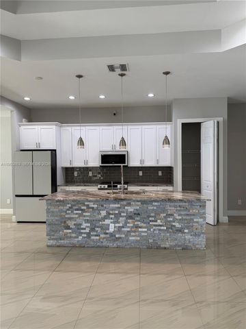 3013 4th ST W, Lehigh Acres, FL 33971