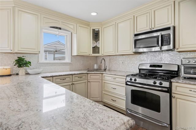 9 Lagoon Boulevard, Massapequa, NY 11758