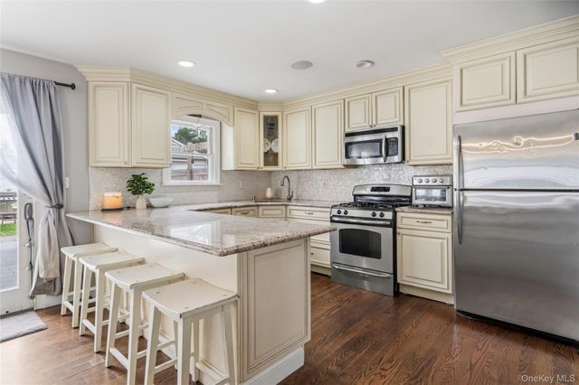 9 Lagoon Boulevard, Massapequa, NY 11758