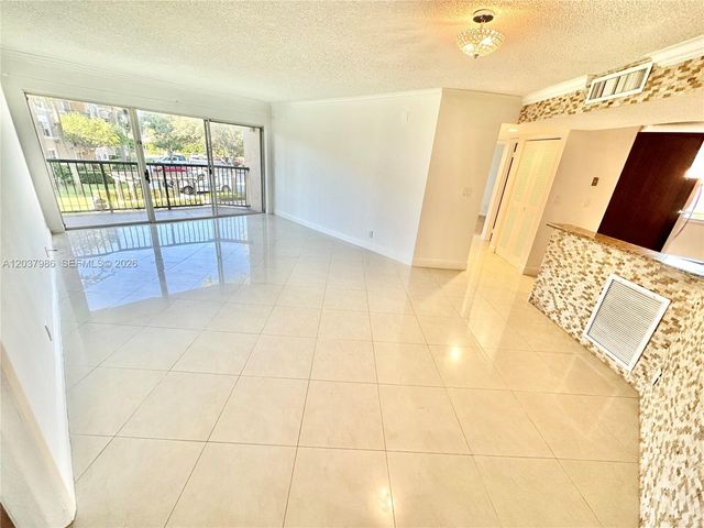 8955 Wiles Road 208, Coral Springs, FL 33067