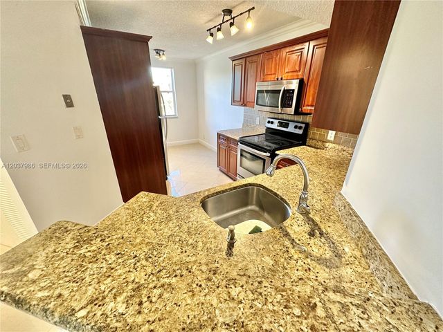 8955 Wiles Road 208, Coral Springs, FL 33067