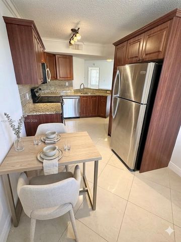 8955 Wiles Road 208, Coral Springs, FL 33067