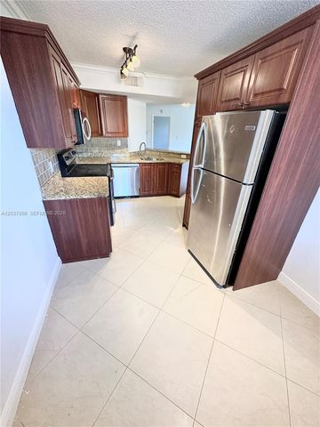 8955 Wiles Road 208, Coral Springs, FL 33067