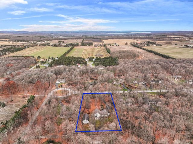 9685 Woodys Run, Long Lake Twp, MI 49684