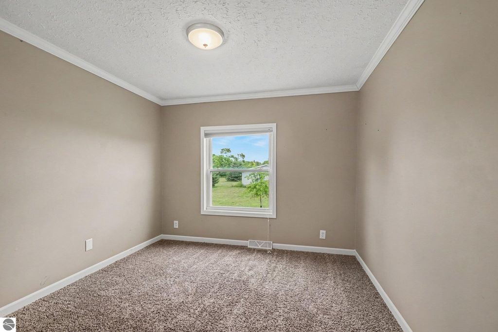 Image 5 of property listing at 1448 E Walton Road, Shepherd, MI 48883