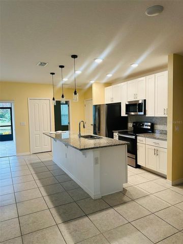 2221 CANYON BREEZE AVENUE, Kissimmee, FL 34746