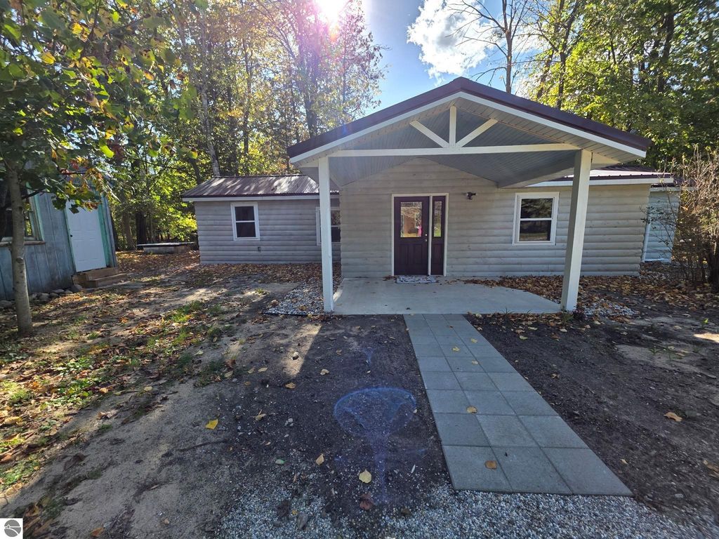 Image 1 of property listing at 1309 Woodin Road, Weidman, MI 48893