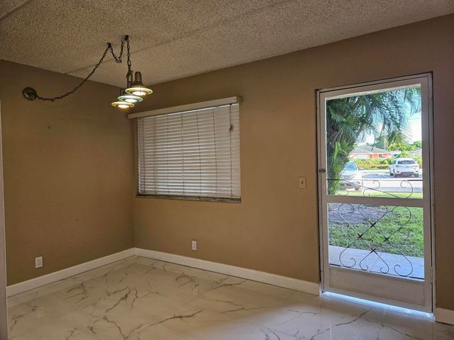 300 VILLAGE GREEN Circle S 114, Palm Springs, FL 33461