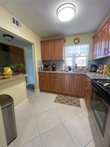 9041 Sunrise Lakes Boulevard 108, Sunrise, FL 33322