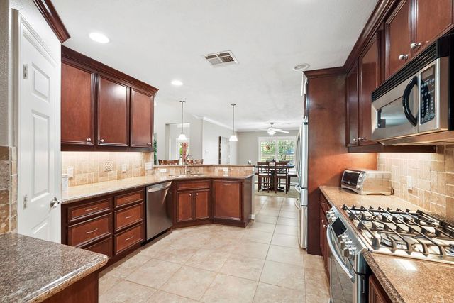 6919 Rustling Oaks Drive, Richmond, TX 77469