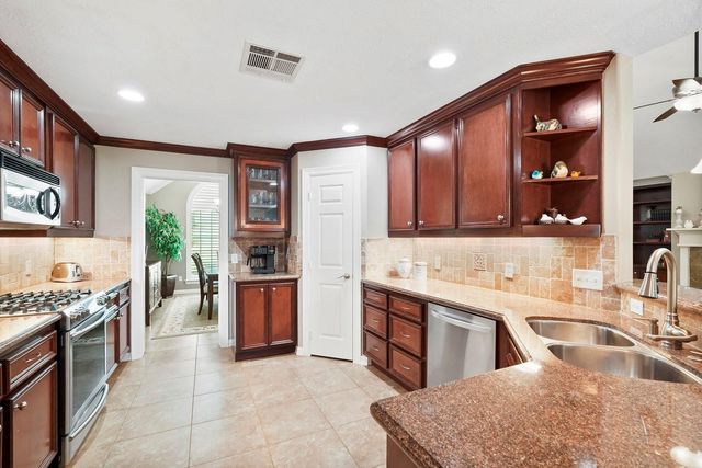 6919 Rustling Oaks Drive, Richmond, TX 77469