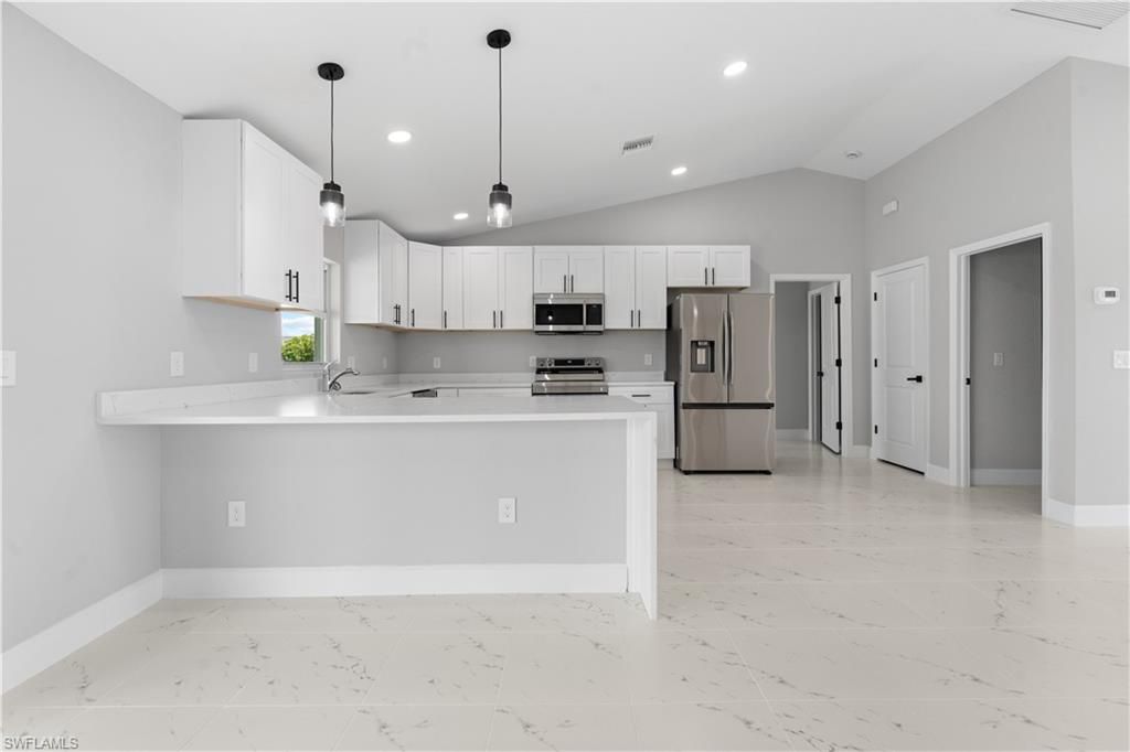 Image 8 of property listing at 1702 Nelson RD N, Cape Coral, FL 33993