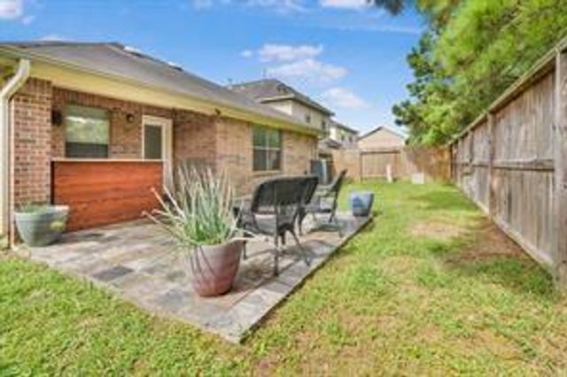 10351 Whisper Bluff Drive, Humble, TX 77396