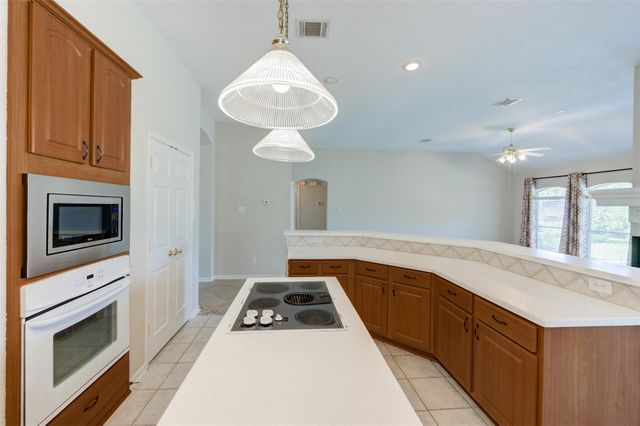9026 Robinhoods Well Drive, Spring, TX 77379