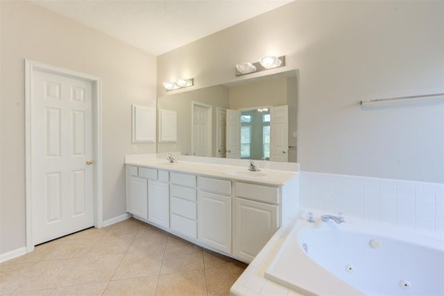 9026 Robinhoods Well Drive, Spring, TX 77379