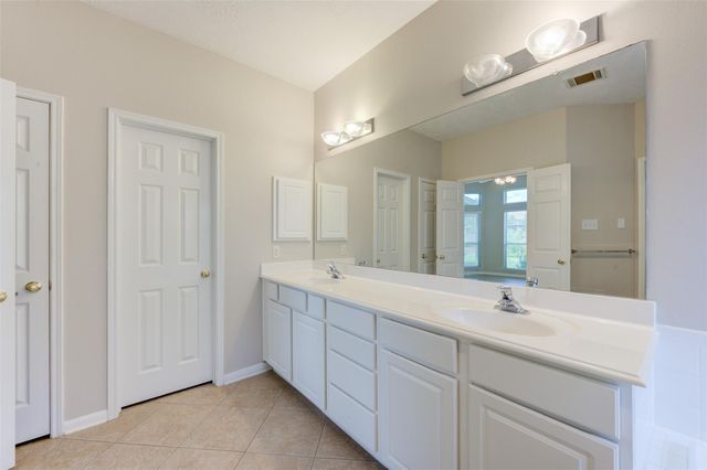 9026 Robinhoods Well Drive, Spring, TX 77379