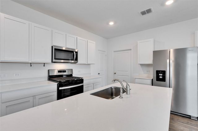 12305 Bulldogger BND, Mustang Ridge, TX 78610