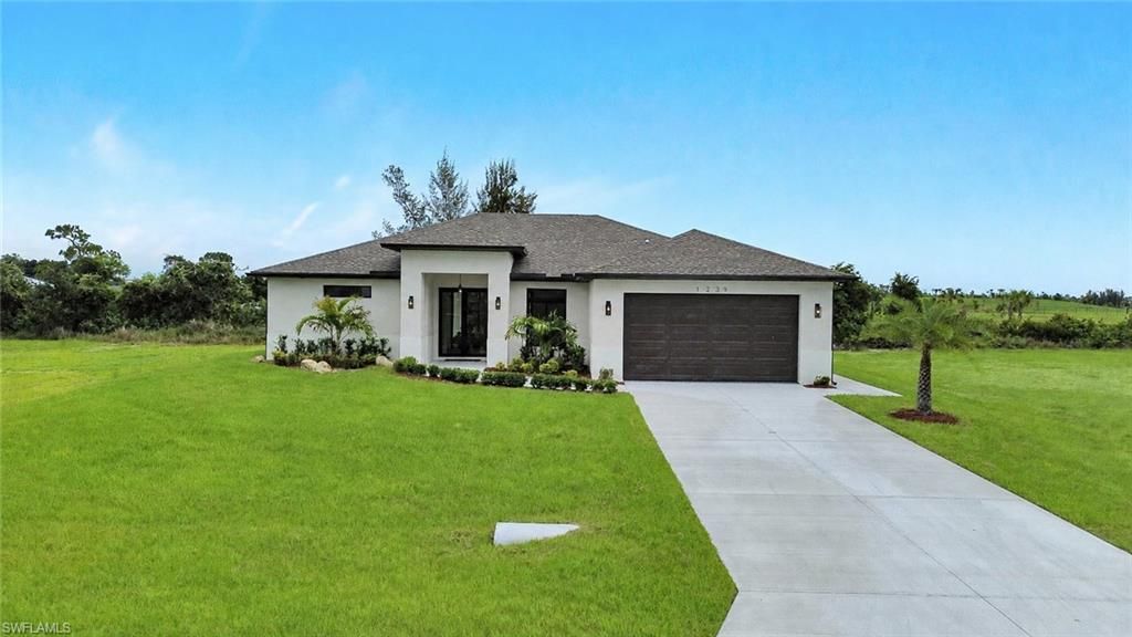 Image 1 of property listing at 1239 NW 24th TER, Cape Coral, FL 33993