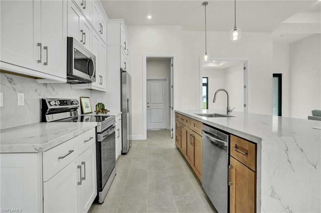 Image 10 of property listing at 1239 NW 24th TER, Cape Coral, FL 33993