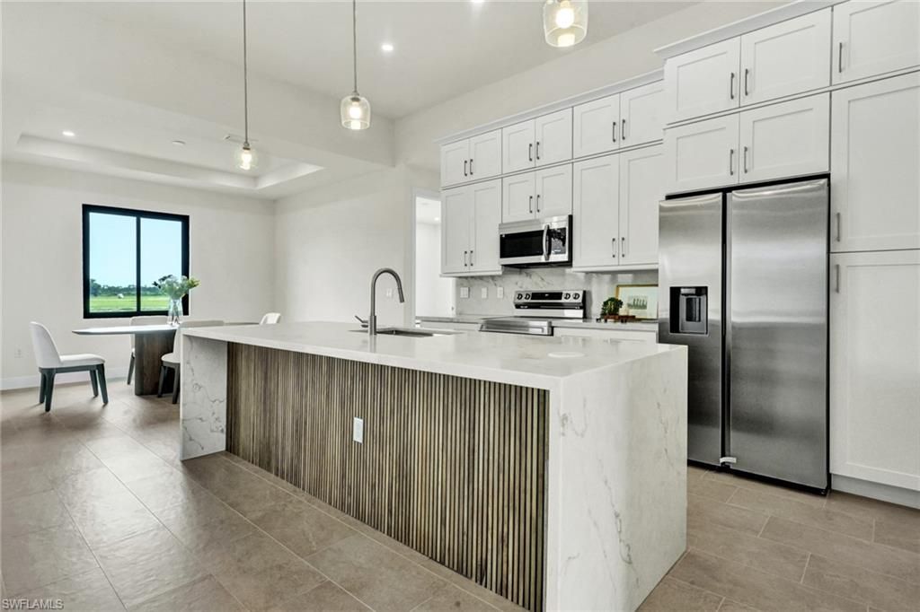 Image 5 of property listing at 1239 NW 24th TER, Cape Coral, FL 33993