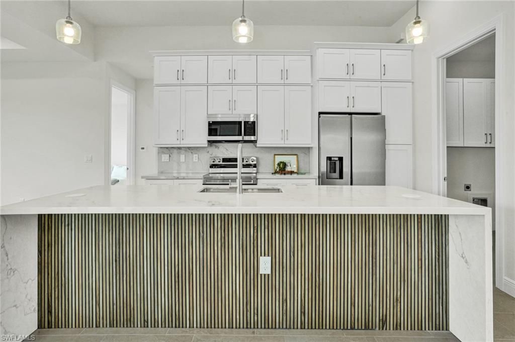 Image 6 of property listing at 1239 NW 24th TER, Cape Coral, FL 33993