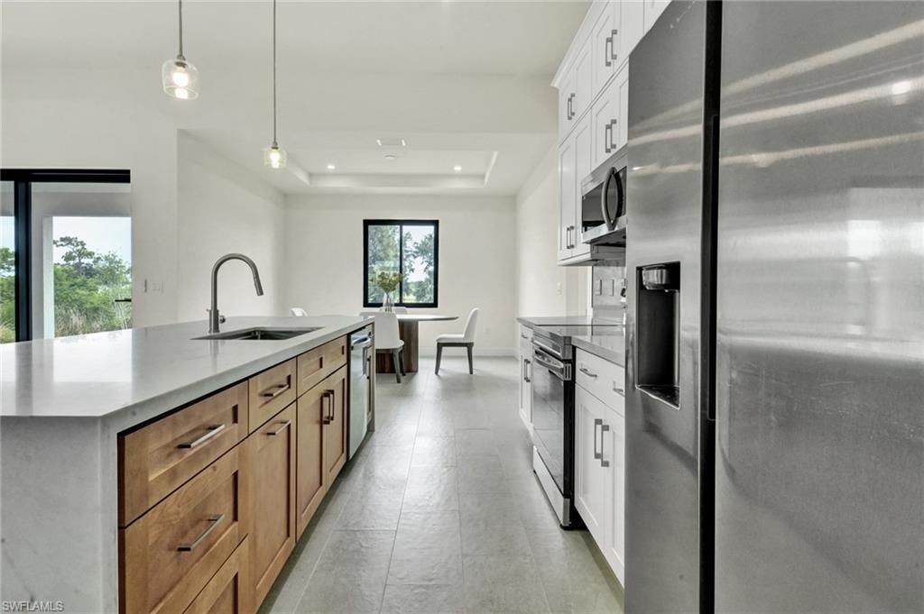 Image 7 of property listing at 1239 NW 24th TER, Cape Coral, FL 33993