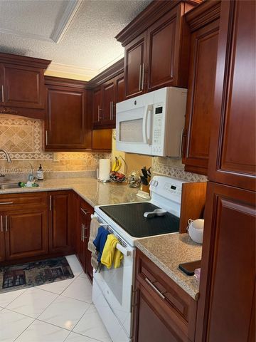 4940 E Sabal Palm Blvd 203, Tamarac, FL 33319