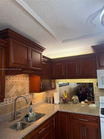 4940 E Sabal Palm Blvd 203, Tamarac, FL 33319