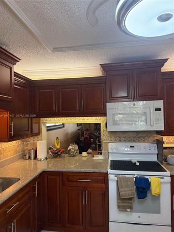 4940 E Sabal Palm Blvd 203, Tamarac, FL 33319