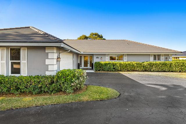 413 S Country Club Drive, Atlantis, FL 33462