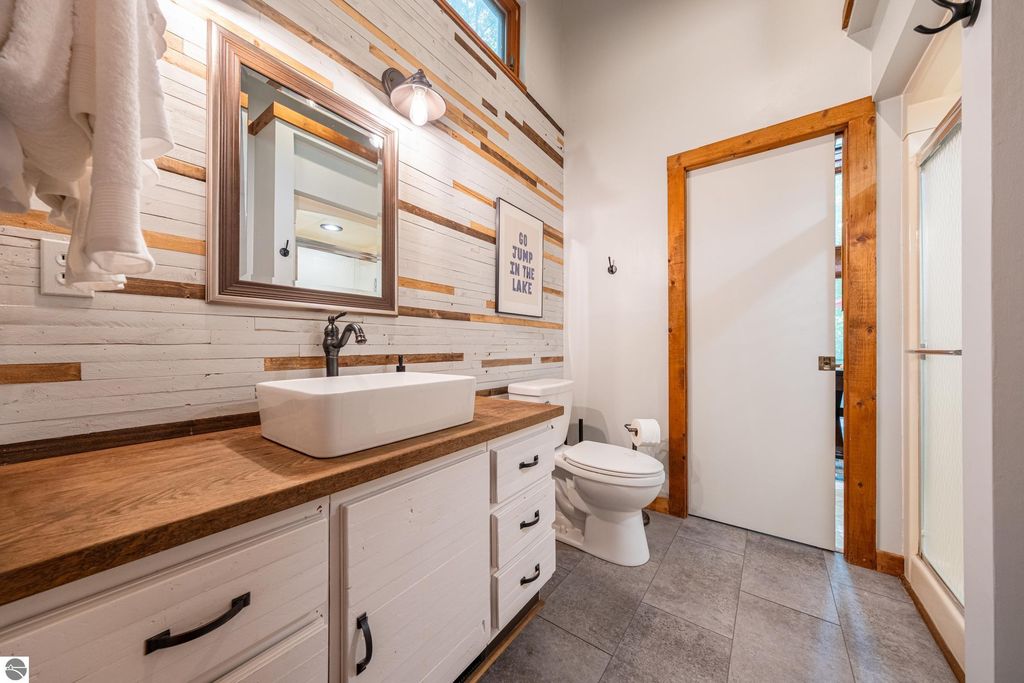 Image 24 of property listing at 5811 East Village Drive, Bellaire, MI 49615