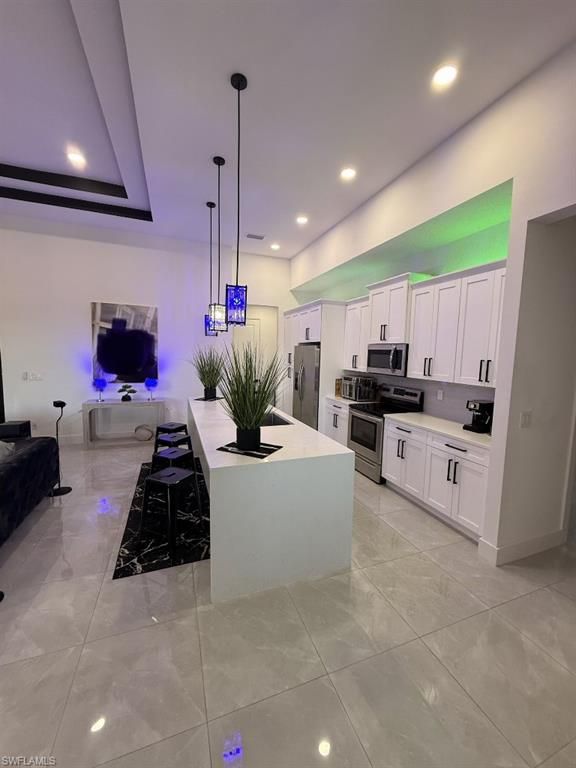 Image 13 of property listing at 907 NE 13th PL, Cape Coral, FL 33909