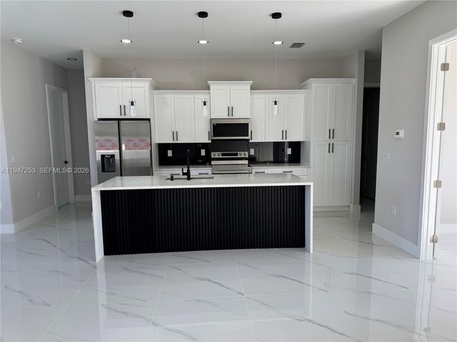 3402 15th ST SW, Lehigh Acres, FL 33976