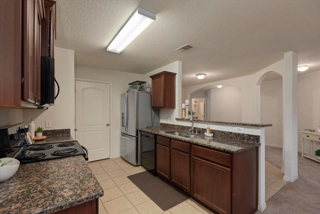 12035 Fairquarter Lane, Pinehurst, TX 77362