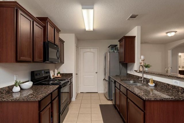 12035 Fairquarter Lane, Pinehurst, TX 77362