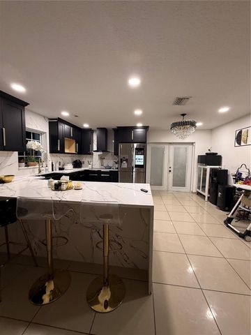 1305 E LOUISE AVENUE, Tampa, FL 33603