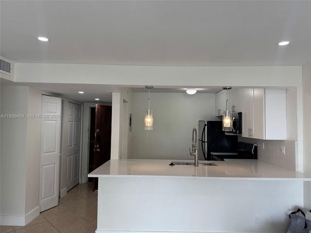 492 NW 165th St Rd C-309, Miami, FL 33169