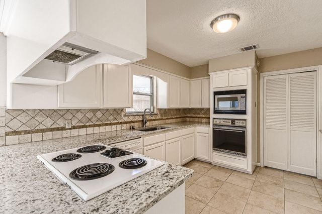19527 Enchanted Oaks Drive, Spring, TX 77388
