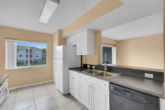 9645 NW 1st Court 1-210, Pembroke Pines, FL 33024