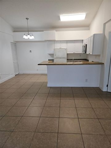 831 Lyons Road 23203, Coconut Creek, FL 33063