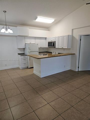 831 Lyons Road 23203, Coconut Creek, FL 33063