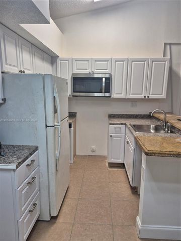 831 Lyons Road 23203, Coconut Creek, FL 33063