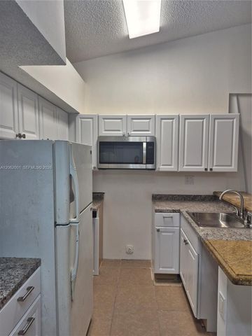831 Lyons Road 23203, Coconut Creek, FL 33063