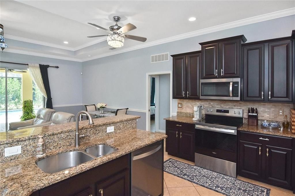 2549 Ashbury CIR, CAPE CORAL, FL 33991 — photo 4