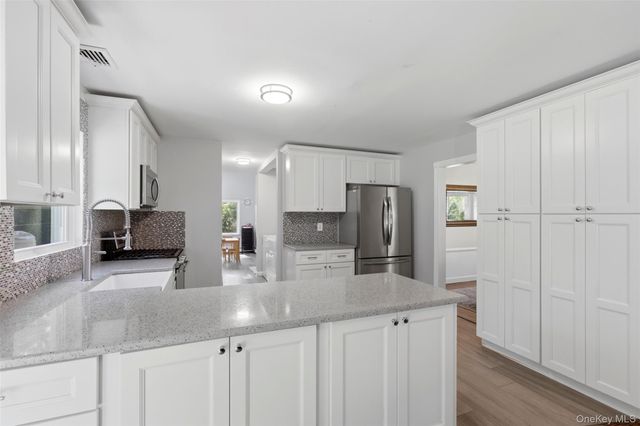 9 Northumberland Drive, Shoreham, NY 11786