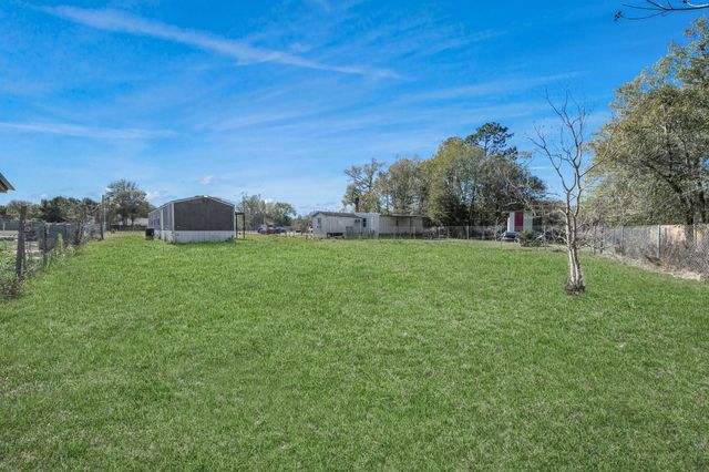 597 County Road 3406, Cleveland, TX 77327