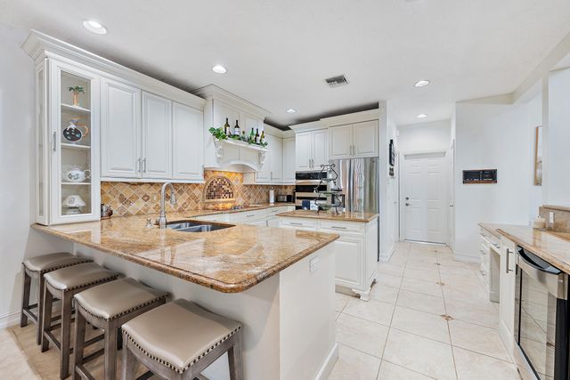 27 Grand Bay Circle, Juno Beach, FL 33408