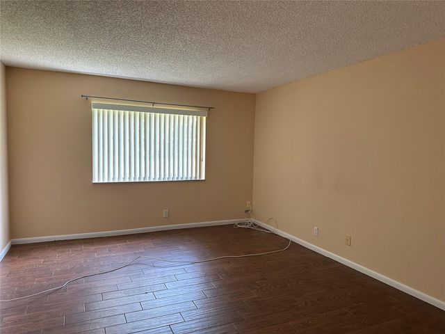 310 Racquet Club Road 103, Weston, FL 33326