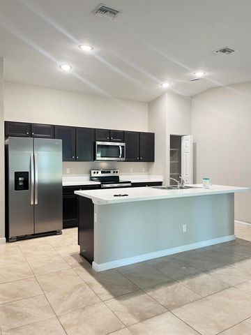 1133 SW Ingrassina Avenue, Port St Lucie, FL 34953